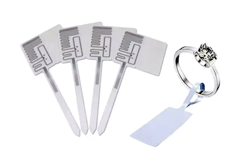 Small jewellery tags hanging on a string